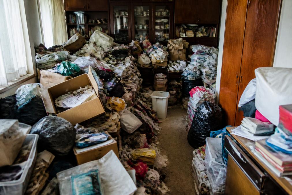 Hoarded room being assessed for access, fire and sanitation hazards
